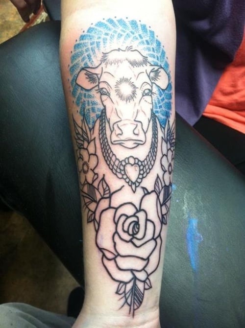 Little cow and pig tattoo placed on the upper arm