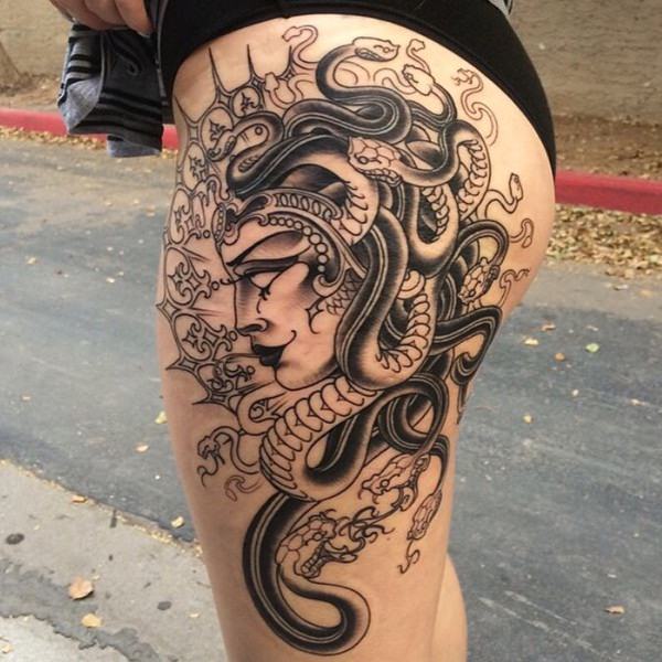 Black and grey Medusa tattoo on the left hand