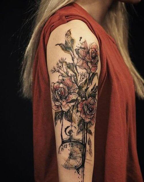 Illustrative style flower tattoo on the left upper arm