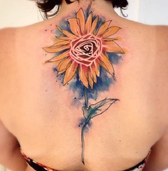 Watercolor style sunflower tattoo on the inner forearm